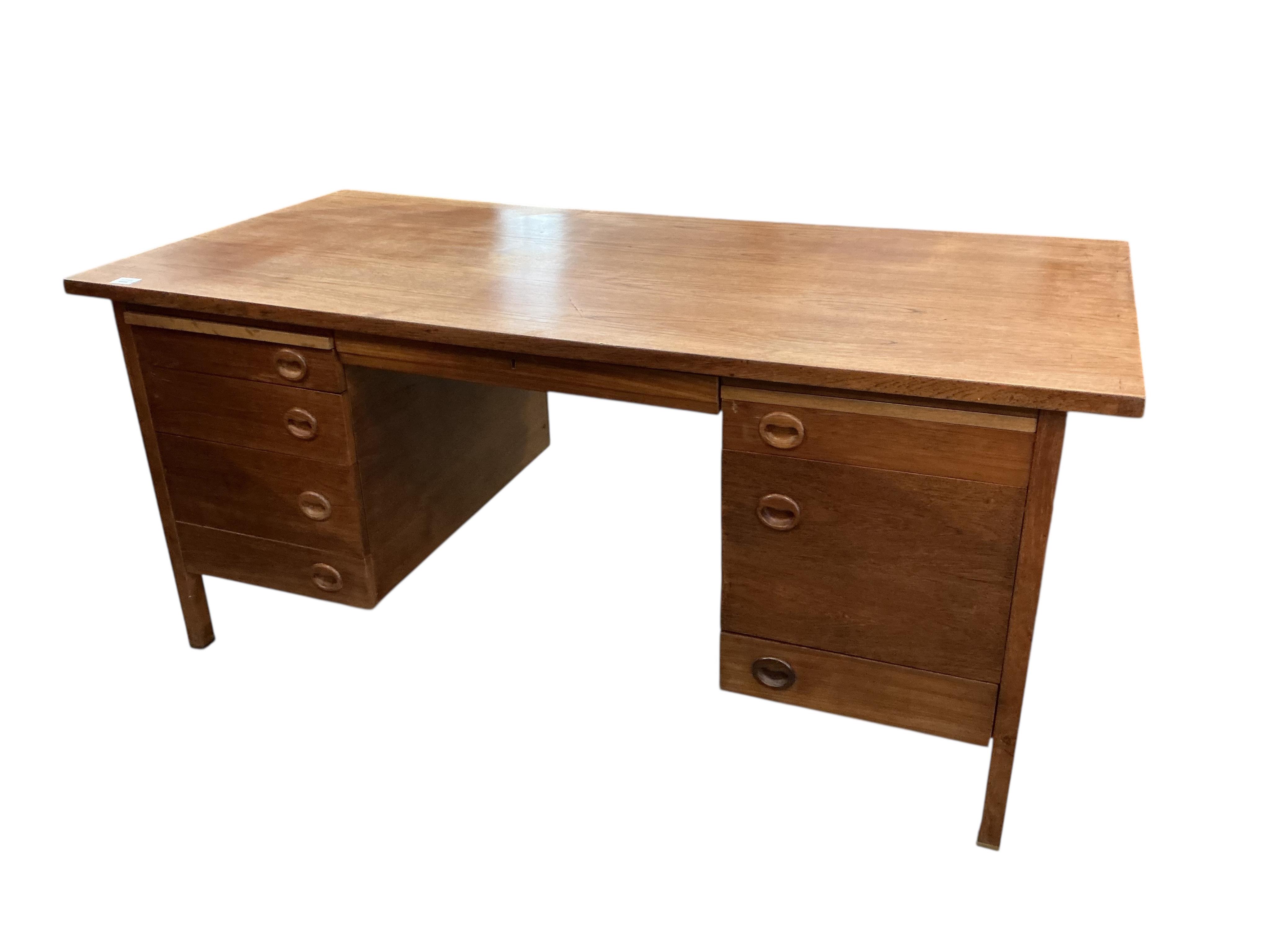 A mid century teak kneehole desk, width 160cm, depth 81cm, height 75cm